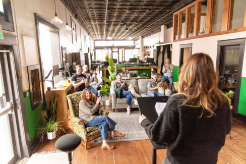 Shawna Meyer teaching a class at Nest:Space™ from the stage on the main level, designed by Shawna Meyer Design™, Interior Design and Project Management