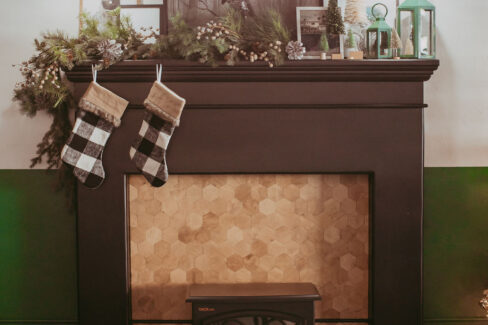 Cozy fireplace with lounging chairs at Nest:Space™ coworking, on the main level, designed by Shawna Meyer Design™, Interior Design and Project Management