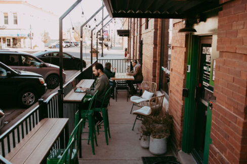 Members meeting and working in the Nest:Space™ coworking outdoor seating area, designed by Shawna Meyer Design™, Interior Design and Project Management