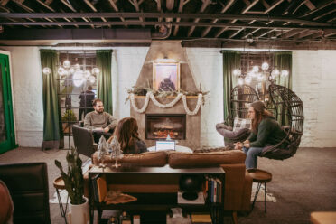 Micro Meeting area where members meet eachother or clients at Nest:Space™ coworking, in the basement private desk room, designed by Shawna Meyer Design™, Interior Design and Project Management