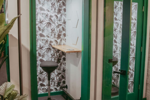 Sound proof phone booths with auto motion lights and fans at Nest:Space™ coworking, in the basement private desk room, designed by Shawna Meyer Design™, Interior Design and Project Management